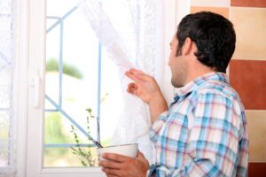 photodune-4788286-man-looking-out-window-s