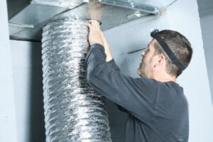 man installing hvac tubing