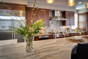 Kitchen counter with flower and wine glasses
