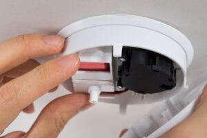 photodune-10773508-handyman-repairing-smoke-detector-s