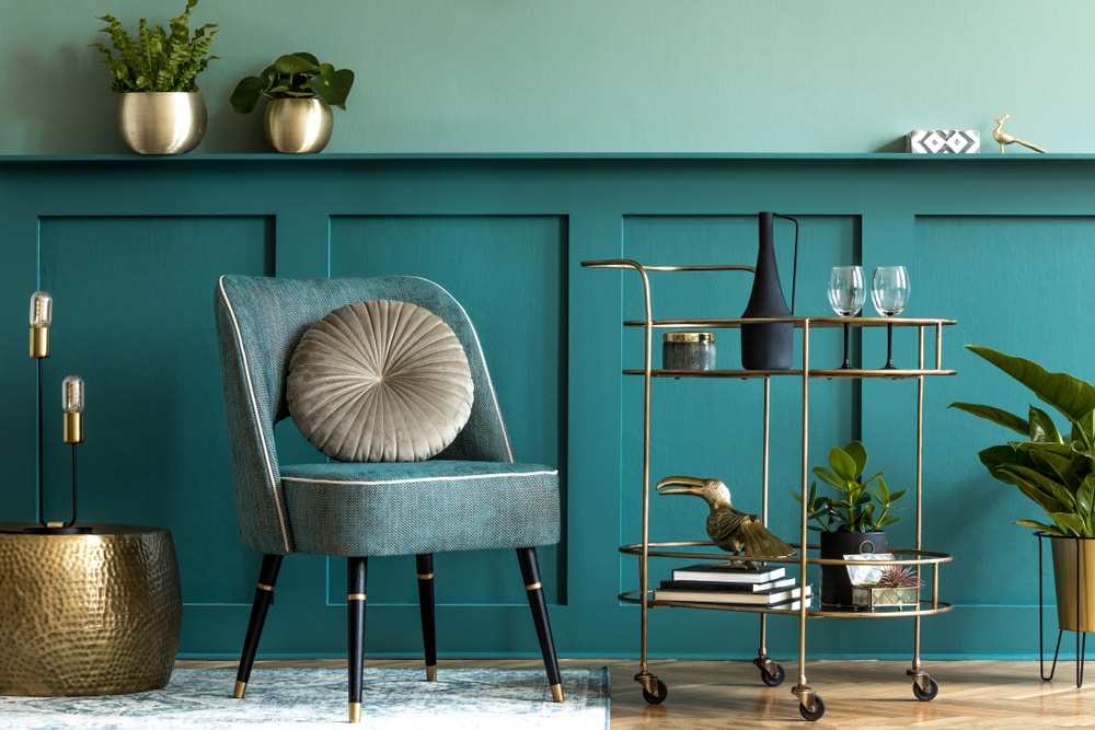 Turquoise chair, bar cart, and other decorative items