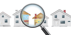 An illustration of a row of houses with a giant magnifying glass showing the inside of one of the houses.