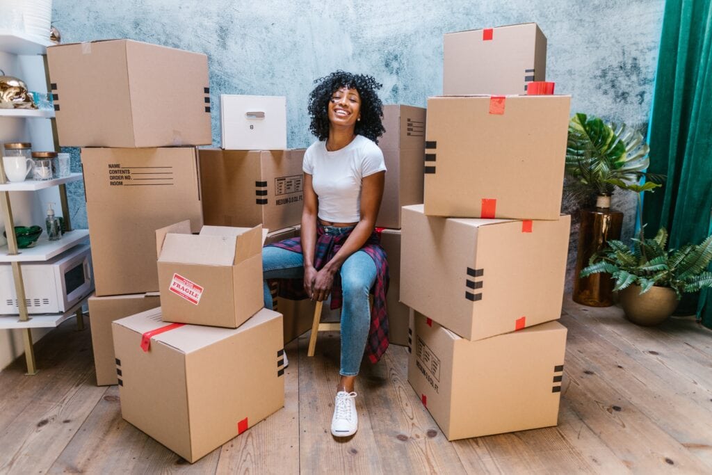 Woman packing up moving boxes