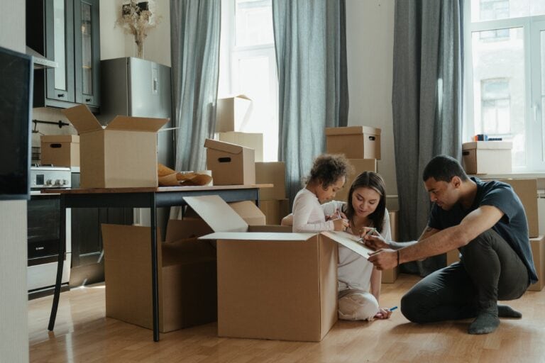 Family packing moving boxes