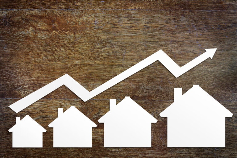 Concept,Of,Real,Estate,Sales,Growth, Price per square foot, picture of white, cutout houses gradually getting bigger in size with an arrow pointed up and to the right